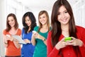 Young asian woman using mobile gadget. with diverse woman at the