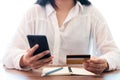 Young asian woman using smart phone and credit card Royalty Free Stock Photo