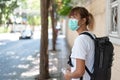 Young Asian woman wear surgical protection face mask travel in the city Royalty Free Stock Photo