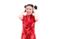 Young Asian woman wearing chinese dress cheongsam with shocked facial expression. Portrait of surprised beautiful girl Royalty Free Stock Photo