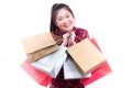 Young asian woman wearing chinese dress traditional cheongsam with Carrying a shopping bag and smile. Royalty Free Stock Photo