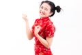 Young asian woman wearing chinese dress traditional cheongsam with gesture of congratulation, Royalty Free Stock Photo