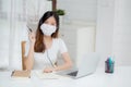 Young asian woman wearing headphone study online with e-learning on desk, girl wearing headset learning. Royalty Free Stock Photo