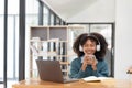 Young asian woman wearing headset working on computer laptop at house. Work at home, Video conference, Video call Royalty Free Stock Photo