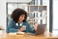 Young asian woman wearing headset working on computer laptop at house. Work at home, Video conference, Video call Royalty Free Stock Photo