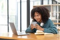 Young asian woman wearing headset working on computer laptop at house. Work at home, Video conference, Video call Royalty Free Stock Photo