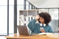 Young asian woman wearing headset working on computer laptop at house. Work at home, Video conference, Video call Royalty Free Stock Photo