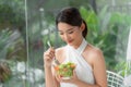 Young asian woman who eats Royalty Free Stock Photo