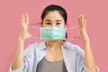 Young asian woman worea gray tank top, Blue shirt and protective masks against and air pollution,make gesture Coughing,