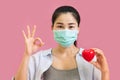 Young asian woman worea gray tank top, Blue shirt and protective masks against virus and air pollution,make gesture Coughing,
