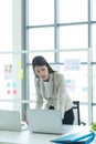 Young asian woman working at a call center Consulting about stock investment information with customers calling Royalty Free Stock Photo