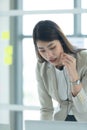 Young asian woman working at a call center Consulting about stock investment information with customers calling Royalty Free Stock Photo