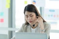 Young asian woman working at a call center Consulting about stock investment information with customers calling for advice Royalty Free Stock Photo