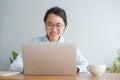 Young asian woman working on laptop in the home office desk Royalty Free Stock Photo