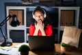 Young asian woman working at the office with laptop at night bored yawning tired covering mouth with hand Royalty Free Stock Photo