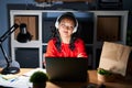 Young asian woman working at the office with laptop at night smiling looking to the side and staring away thinking Royalty Free Stock Photo