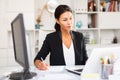 Young asian woman working in office and signs documents Royalty Free Stock Photo