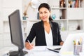 Young asian woman working in office and signs documents Royalty Free Stock Photo