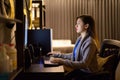 Young Asian woman working overtime at home late at night Royalty Free Stock Photo