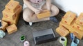 Young Asian woman is writing down the customer`s details and addresses on the notebook or box in order to prepare. Royalty Free Stock Photo