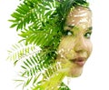 A double exposure woman's portrait merged with a photo of green leaves Royalty Free Stock Photo