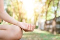 Young asian woman yoga outdoors keep calm and meditates while practicing yoga to explore the inner peace. Royalty Free Stock Photo