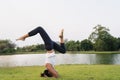 Young asian woman yoga outdoors keep calm and meditates while practicing yoga to explore the inner peace. Yoga have good benefits Royalty Free Stock Photo