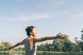 Young asian woman yoga outdoors keep calm and meditates while practicing yoga to explore the inner peace. Yoga have good benefits Royalty Free Stock Photo