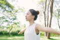 Young asian woman yoga outdoors keep calm and meditates while practicing yoga to explore the inner peace. Royalty Free Stock Photo