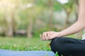 Young asian woman yoga outdoors keep calm and meditates while practicing yoga to explore the inner peace. Royalty Free Stock Photo