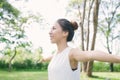 Young asian woman yoga outdoors keep calm and meditates while practicing yoga to explore the inner peace.