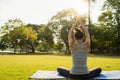 Young asian woman yoga outdoors keep calm and meditates while practicing yoga to explore the inner peace. Royalty Free Stock Photo