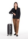 Young asian women in black suit smile and rest her arm on a black suitcase. Portrait on white background with studio light Royalty Free Stock Photo