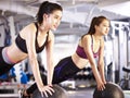 Young asian women exercising with medicine balls Royalty Free Stock Photo