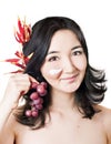 Young asian women with face mask and fruits