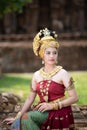 Young Asian women in Traditional dress sit on old wall.Beautiful girls in traditional costume.Thai girl in retro Thai dress Royalty Free Stock Photo