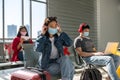 Young woman wear mask in airport terminal Royalty Free Stock Photo