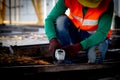 Young asian worker using grinder cut iron with hands working in industrial factory, welder man or labor cut steel. Royalty Free Stock Photo