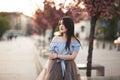 Young Asians girl with modern dress posing in an old Krakow