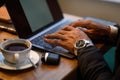 a young aspiring African-American investor works at a computer, analyzes the securities market