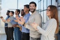 young aspiring young people clapping their hands at the seminar