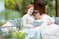 Young assistant hugs elder woman Royalty Free Stock Photo