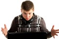 Young astonished businessman working on a laptop Royalty Free Stock Photo