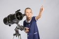 The young astronomer pointing at starry sky