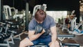 Young athlete Asian guy exercising doing lifting dumbbell fat burning workout in fitness class. Sportsman recreational activity, Royalty Free Stock Photo