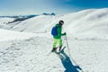 Athlete freestyle Skier having fun while running downhill in beautiful landscape on sunny day during winter season Royalty Free Stock Photo