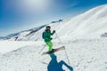 Athlete freestyle Skier having fun while running downhill in beautiful landscape on sunny day during winter season Royalty Free Stock Photo