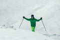 Athlete freestyle Skier having fun while running downhill in beautiful landscape on sunny day during winter season Royalty Free Stock Photo