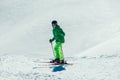 Athlete freestyle Skier having fun while running downhill in beautiful landscape on sunny day during winter season Royalty Free Stock Photo