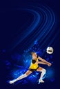 Young athlete, girl, volleyball player in yellow uniform training, playing, hitting ball against blue background with Royalty Free Stock Photo